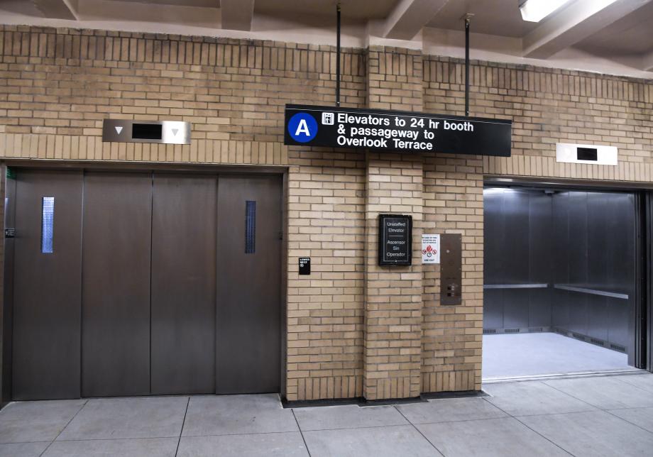 The entrance to an elevator in a subway station. 