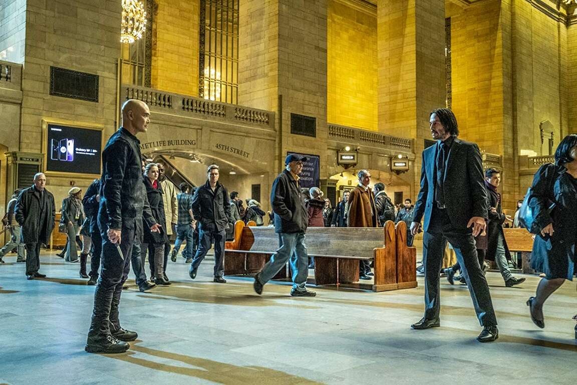 Actors from John Wick 3 stand in Grand Central Terminal