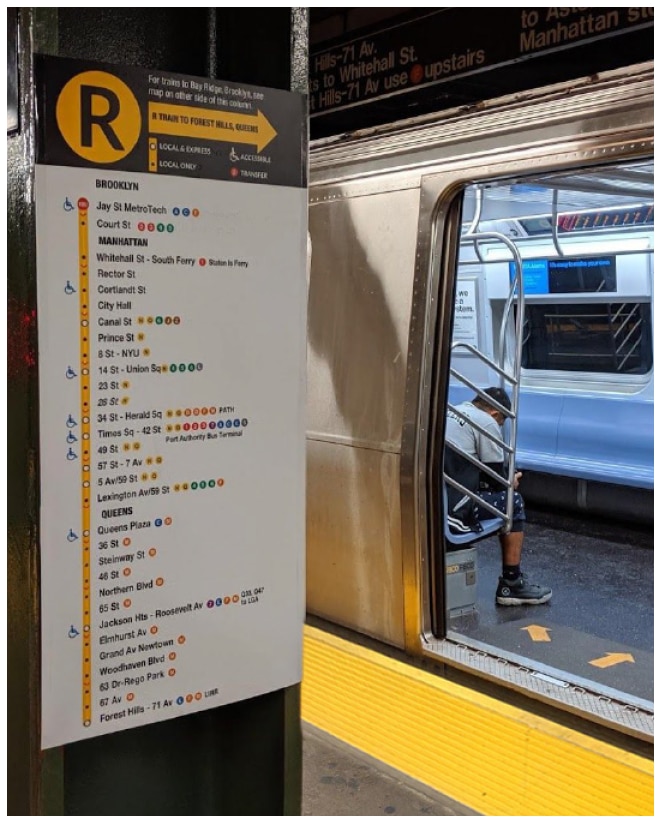 Tactile R line map on column with train in background