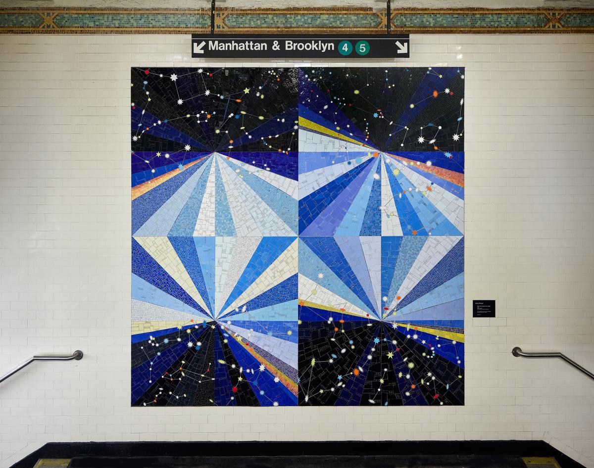 Artwork in mosaic by Amy Pryor showing circles, stars and various shapes in blues, blacks, and other bright colors.     