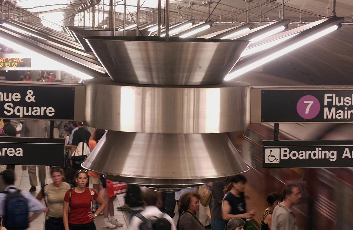 Stainless steel ceiling sculpture by Christopher Sproat on 7 train platform incorporating LED lighting, signage and fan system. 