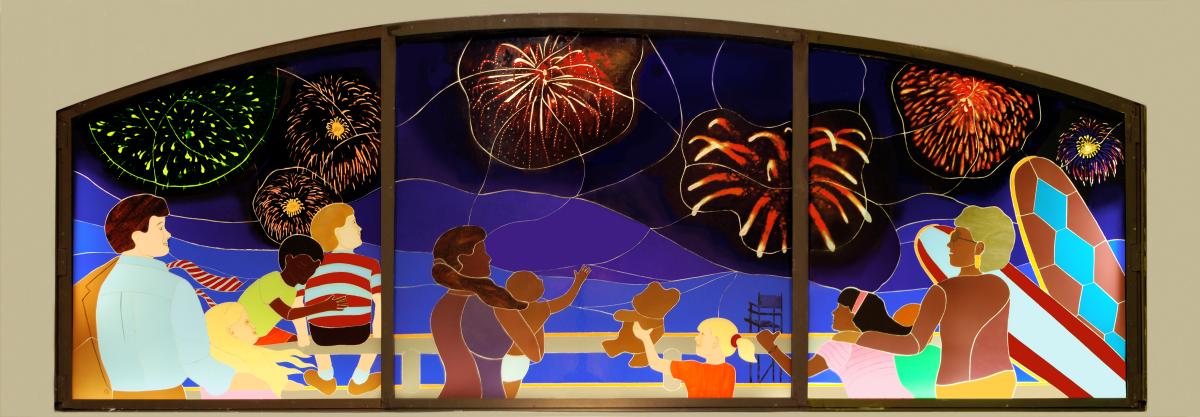 Artwork in laminated glass by KK Kozik showing figures at Rockaway beach at night with fireworks and in the daytime on the beach.