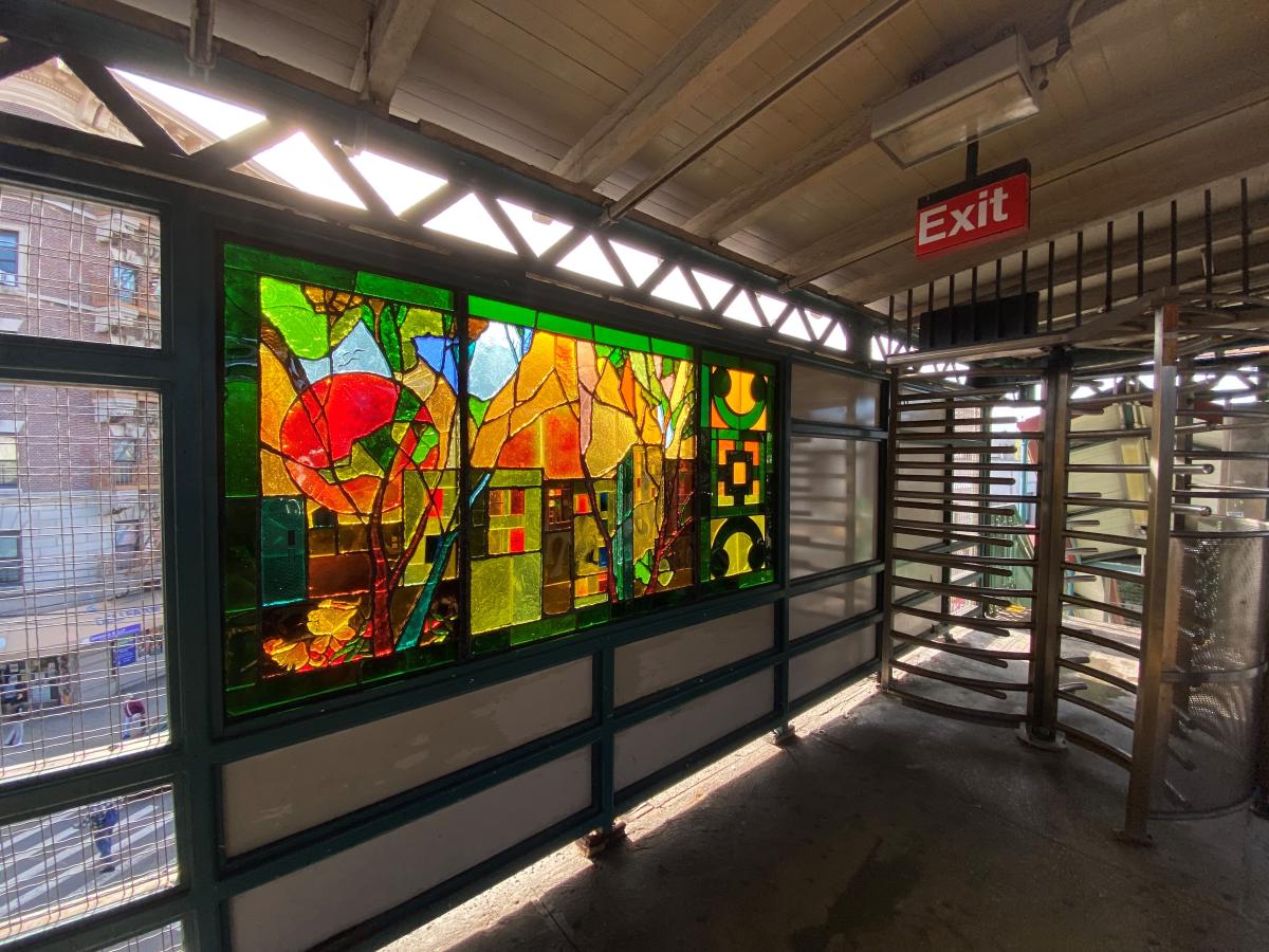 Artwork in faceted glass by Marina Tsersarskaya showing panels of four seasons with views of the Bronx.