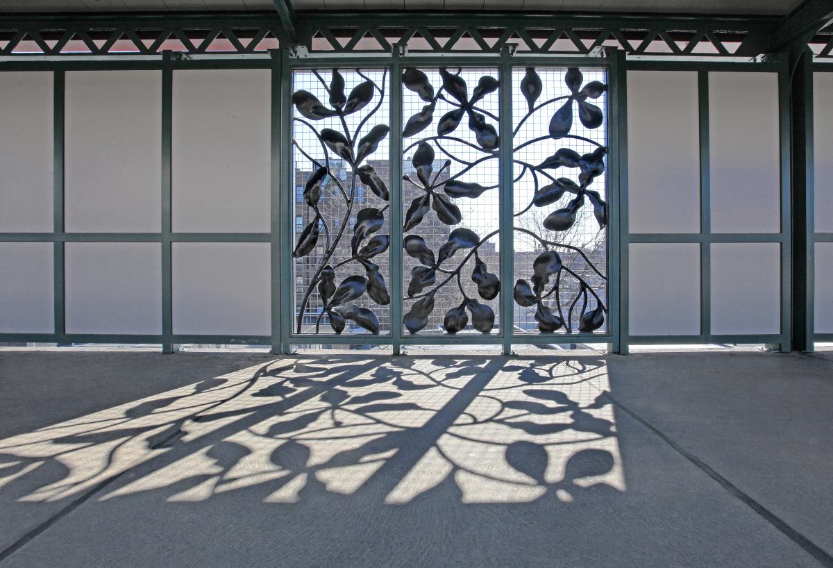 Artwork in wrought steel by Jean Whitesavage and Nick Lyle showing sculptural grilles in leaf patterns.