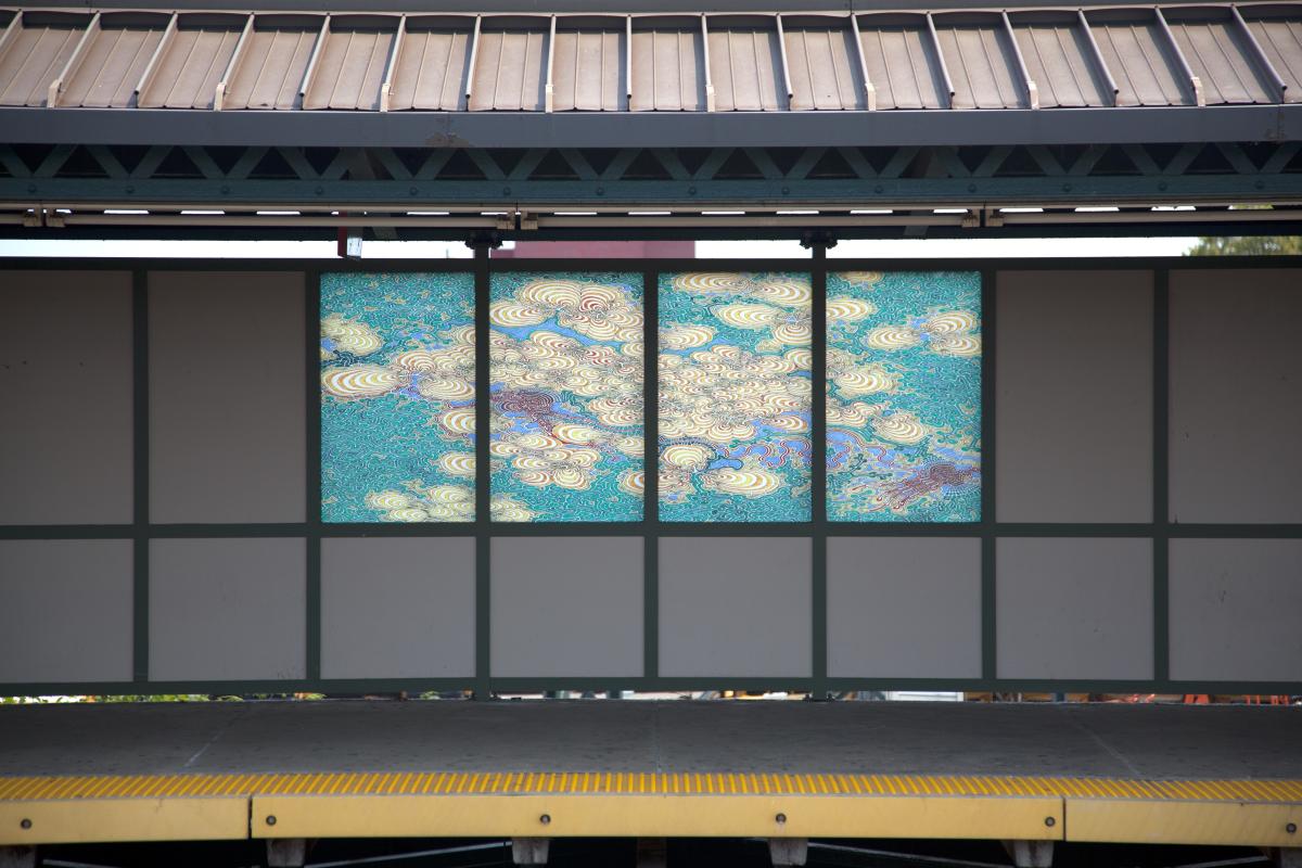 Artwork in laminated glass by Daniel Zeller showing colorful detailed lines and abstract patterning. 