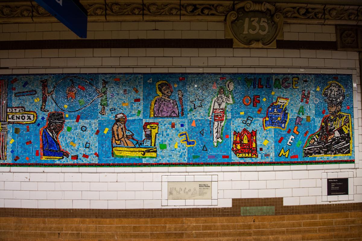Artwork in glass mosaic by Willie Birch showing colorful depictions of figures on a blue background.