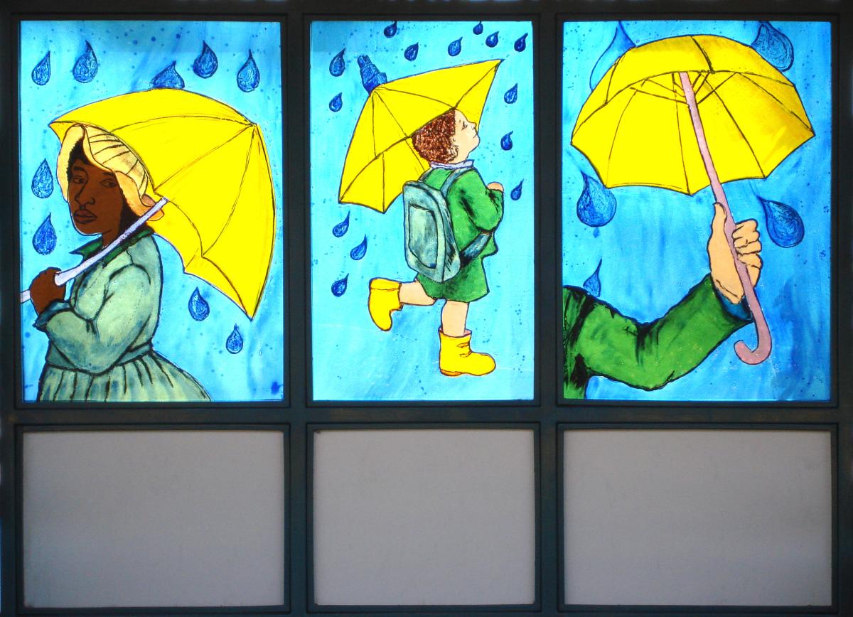 Artwork in fused glass by Philemona Williamson showing colorful life-size figures doing activities. 