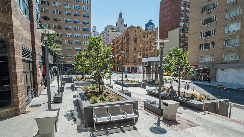 Photo of 63 St plaza on a sunny day