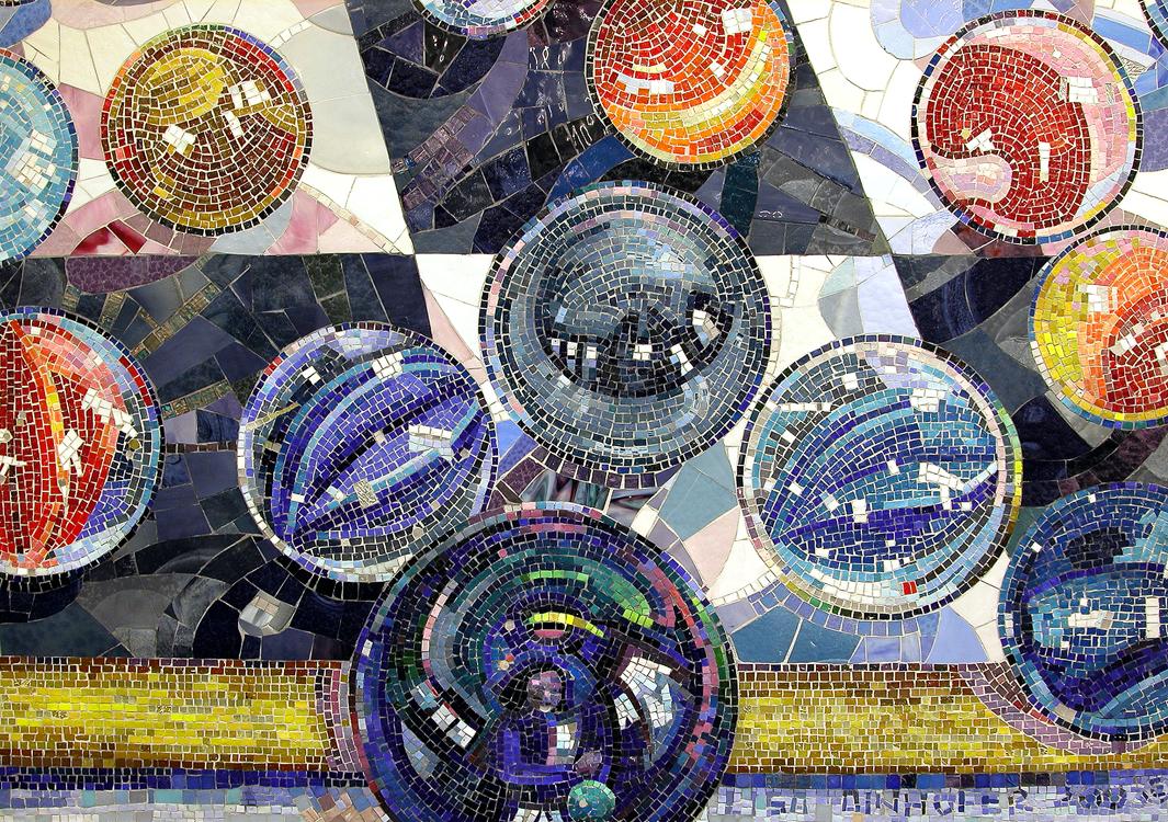 Artwork in glass mosaic by Lisa Dinhofer showing colorful marbles. 