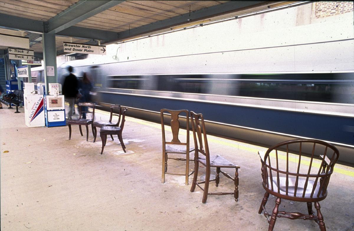 Artwork in cast bronze by Kane Do and Jane Greengold showing 22 sculptural chairs in groupings throughout the station. 