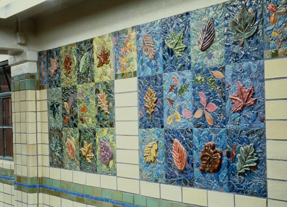Artwork in fired clay and mosaic by Susan Tunick showing colorful foliage.