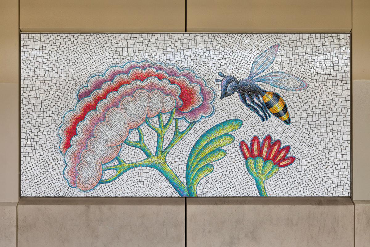 Artwork in glass and ceramic mosaic by Andrea Dezsö showing plants and animals in bright colors. 