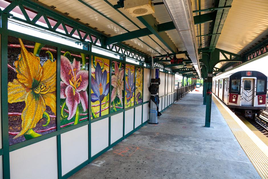 Artwork in mosaic by Jaime Arredondo showing brightly colored flowers. 