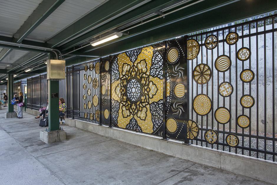Metalwork wall art by Dan Funderburgh showing fractals and flower designs in bronze and black. 