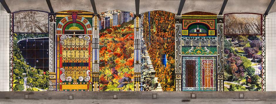 Straight-on view photograph of mosaic artwork by Joyce Kozloff on station platform wall. 