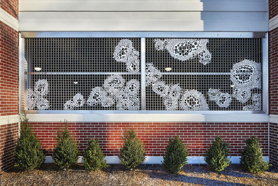 Artwork in metal by SITU Studio showing abstract patterns and forms. 