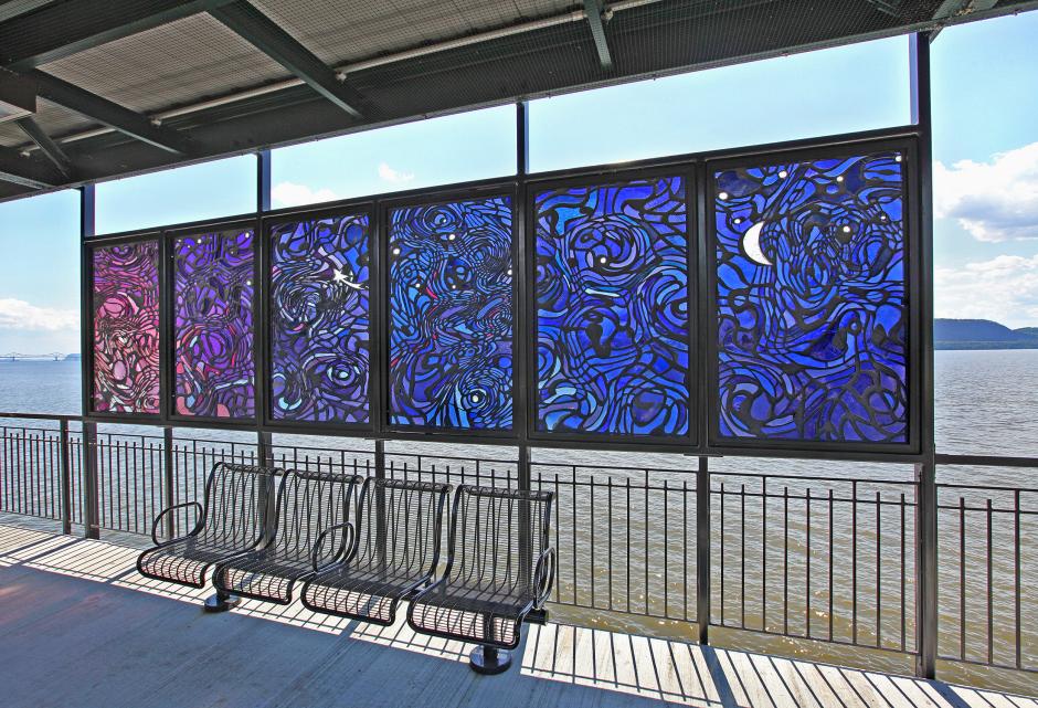 Artwork in faceted glass by Liliana Porter and Ana Tiscornia showing windows depicting the starts, moon and sky.