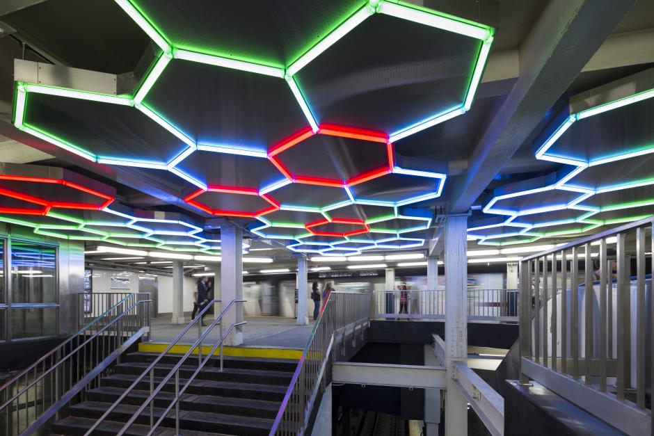 Artwork made from LED tubes by Leo Villareal showing a light sculpture installed in a hexagonal patter on the station ceiling. 