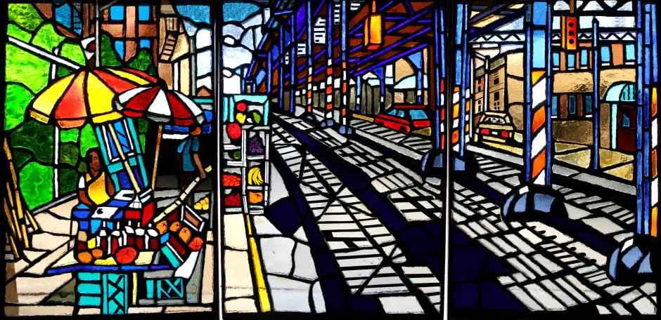 Artwork in faceted glass by Daniel Hauben showing colorful scenes of Bronx streets.