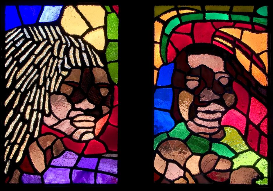 Artwork in faceted glass by Amir Bey showing faces in blocks of color.  
