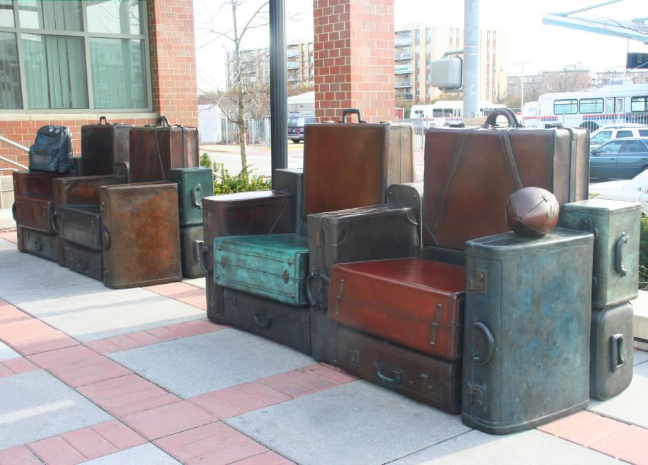 Artwork in cast bronze by Ron Baron showing sculptures and sculptural in the seating in plaza. 