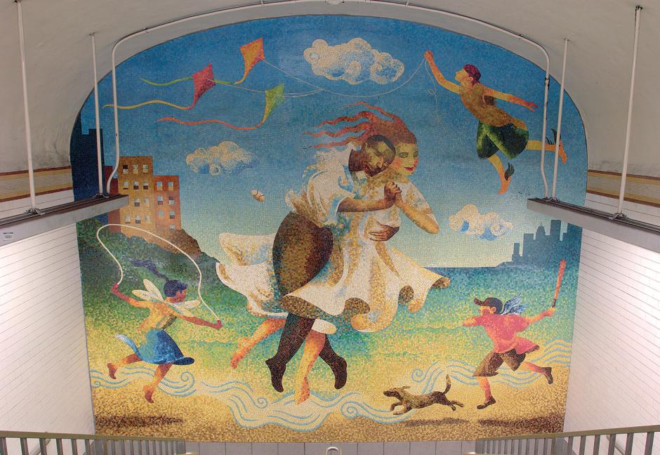Artwork in ceramic mosaic and faceted glass by Raúl Colón showing a man and woman dancing and children at play.  