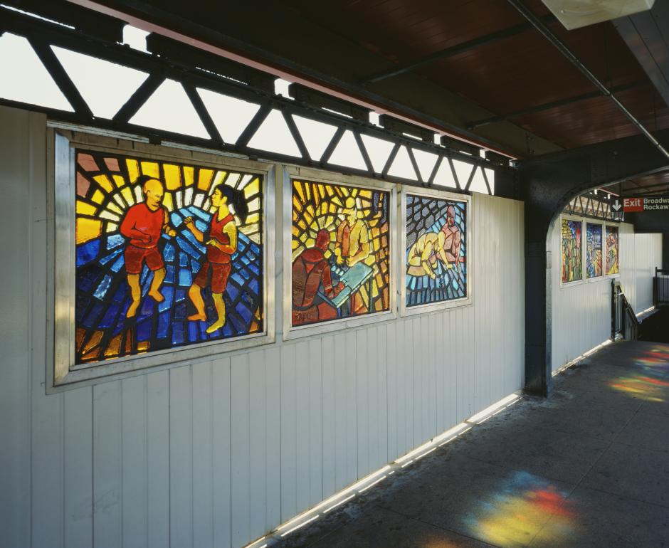 Artwork in faceted glass by Maria Dominguez showing brightly colored scenes of people in the neighborhood.  