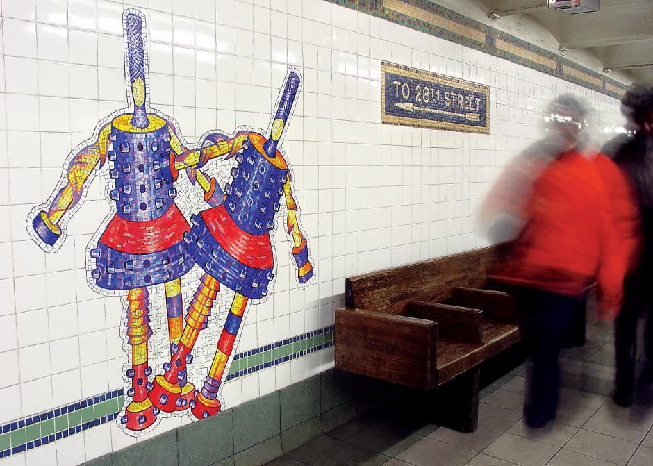 Artwork in glass mosaic by Mark Hadjipateras showing colorful and playful robot-like creatures throughout the station walls.  