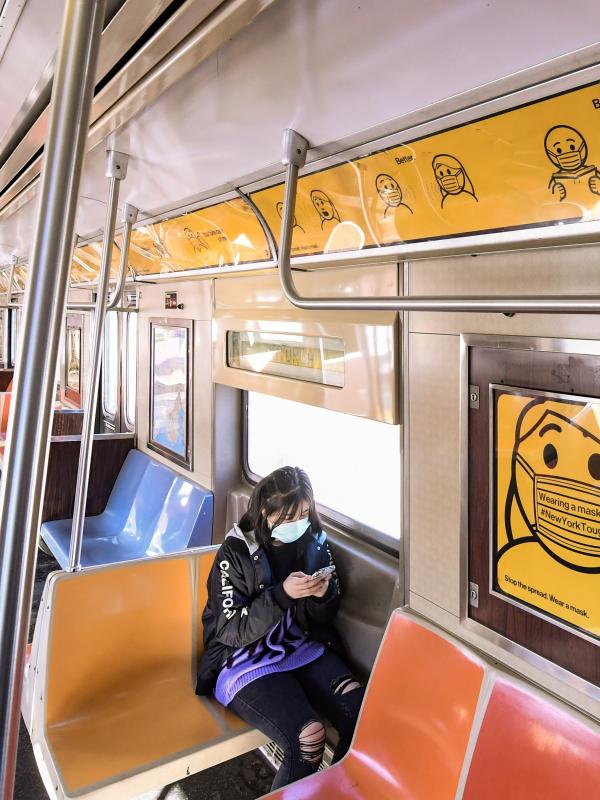Photograph of Safe Travels messages in a subway car
